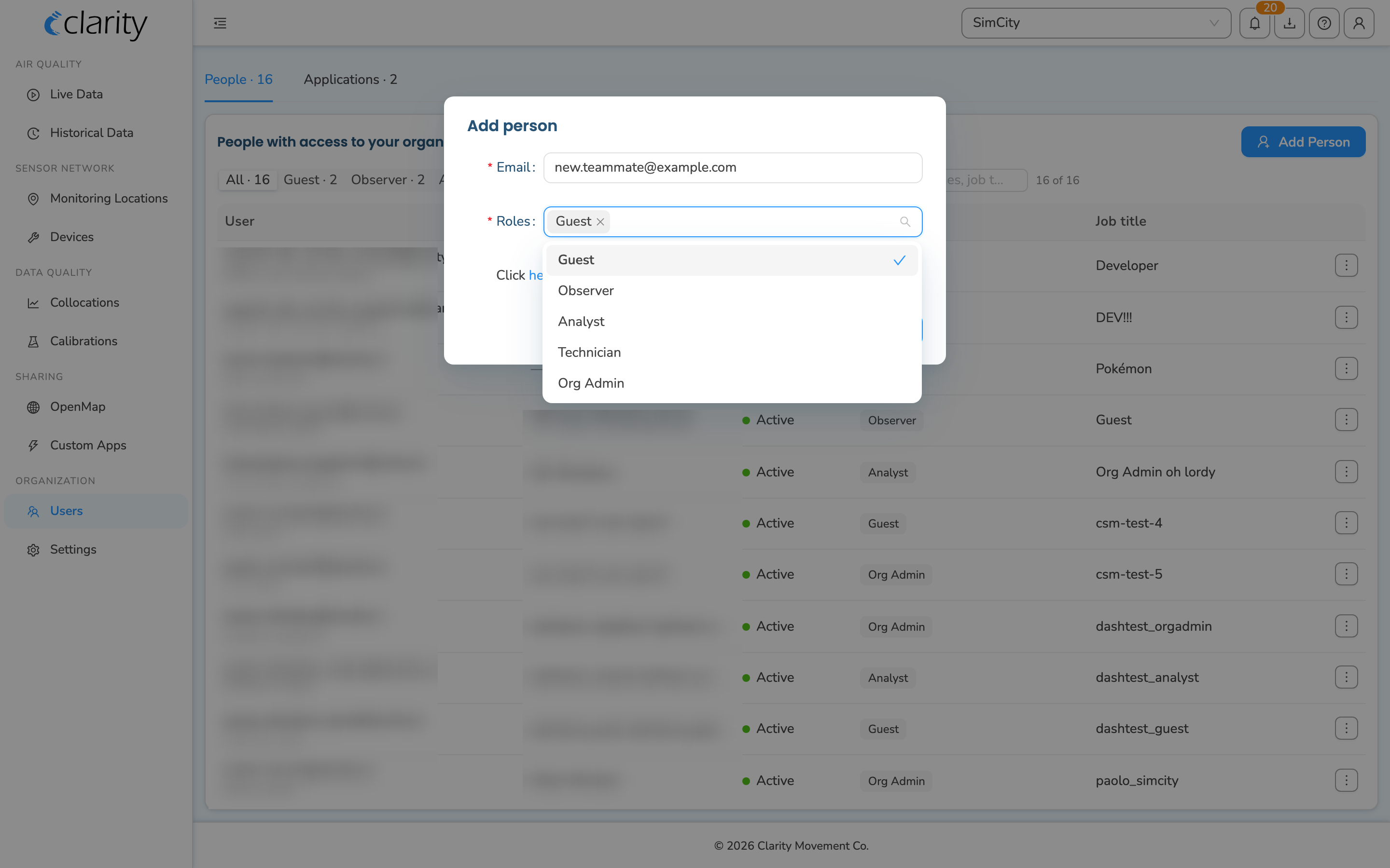 The Add person dialog with the Email field filled in and the Roles dropdown open, showing Guest, Observer, Analyst, Technician, and Org Admin