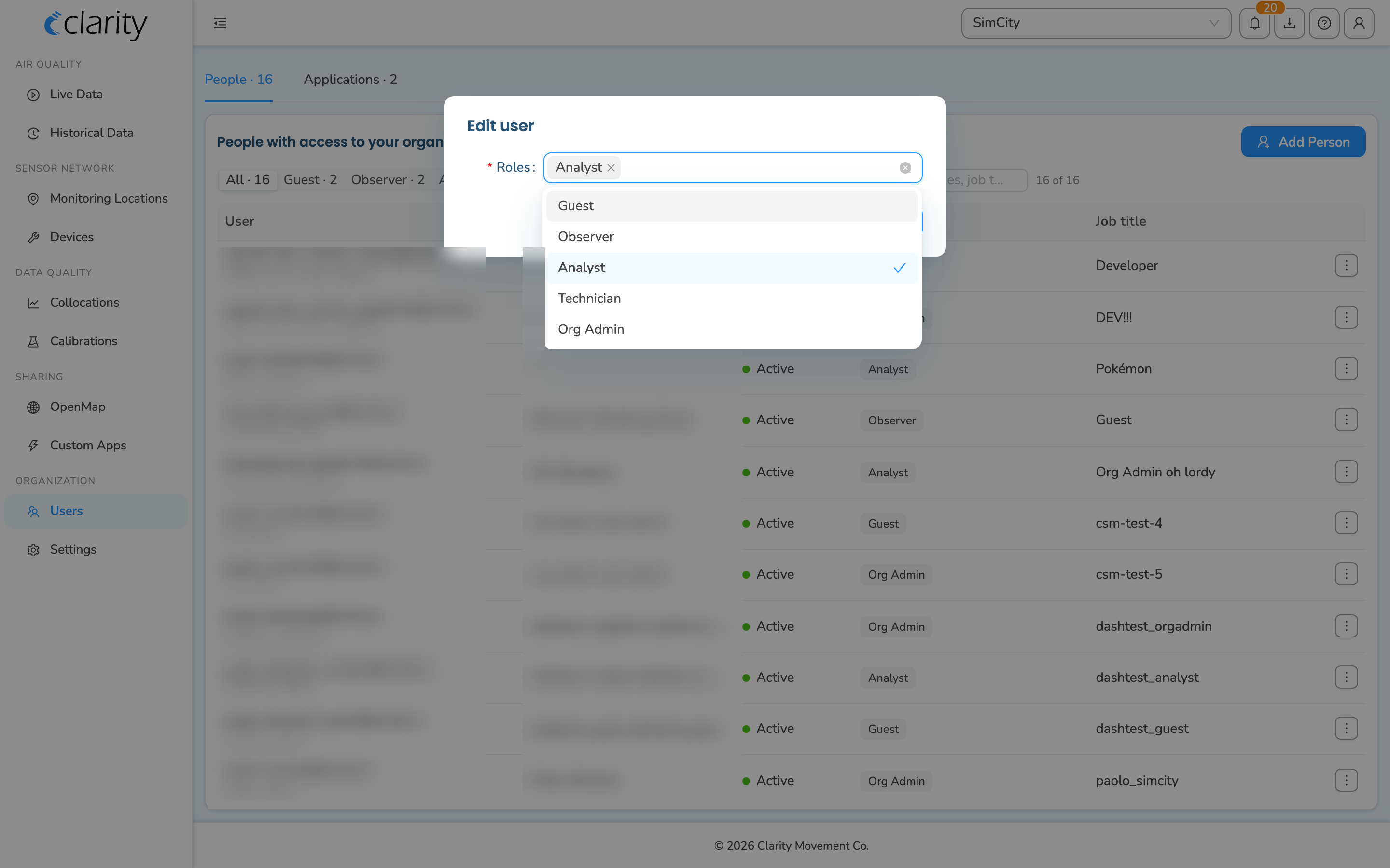 The Edit user dialog with the Roles multiselect open and Analyst checked