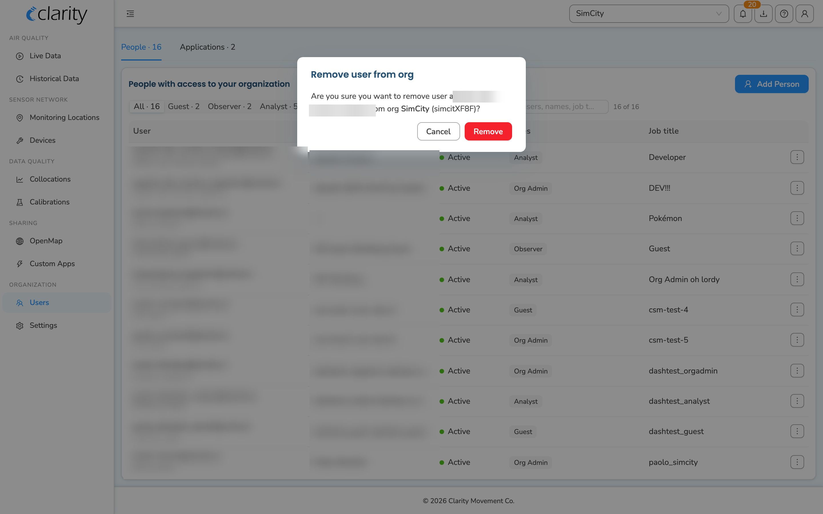 The Remove user from org confirmation dialog naming the user and organization, with a red Remove button